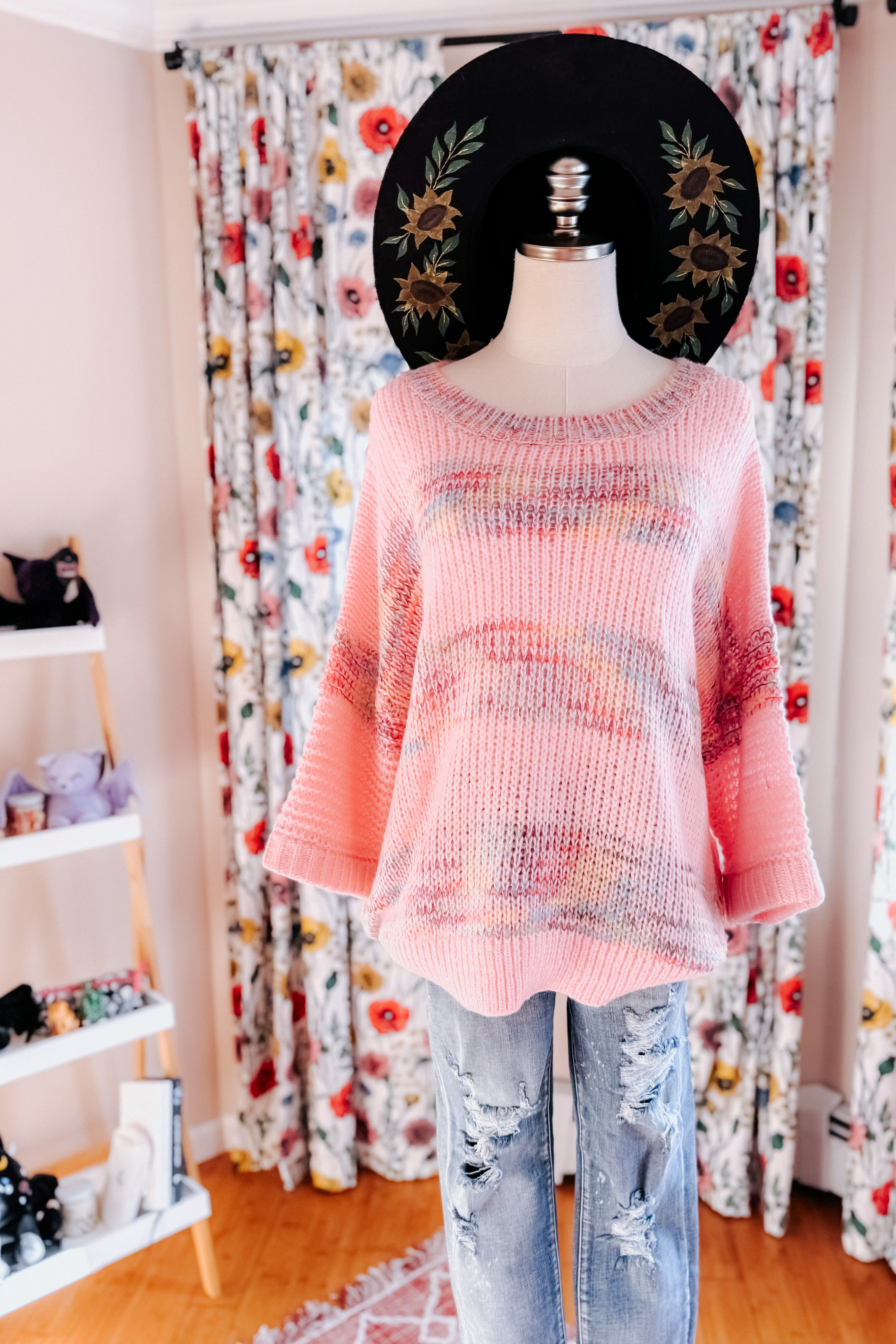 Pink In the Cards Striped Sweater with loose knit and subtle multicolor patterns displayed on mannequin with distressed jeans