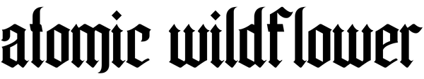 Atomic Wildflower logo in a black gothic font on a transparent background