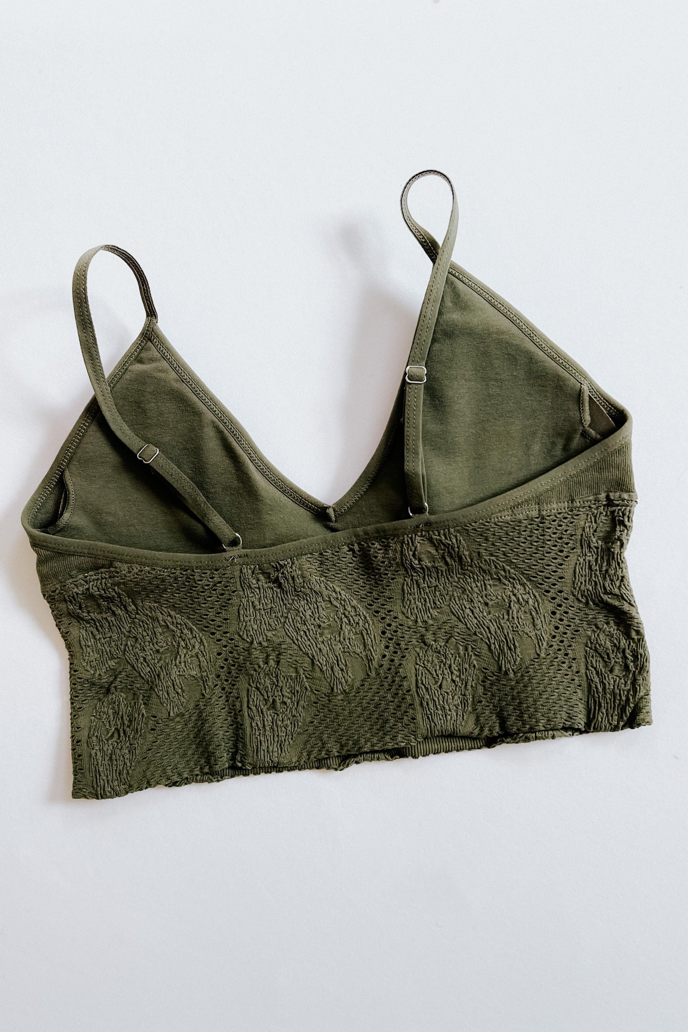 Olive green seamless brami with adjustable straps and textured knit detailing laid flat on white background