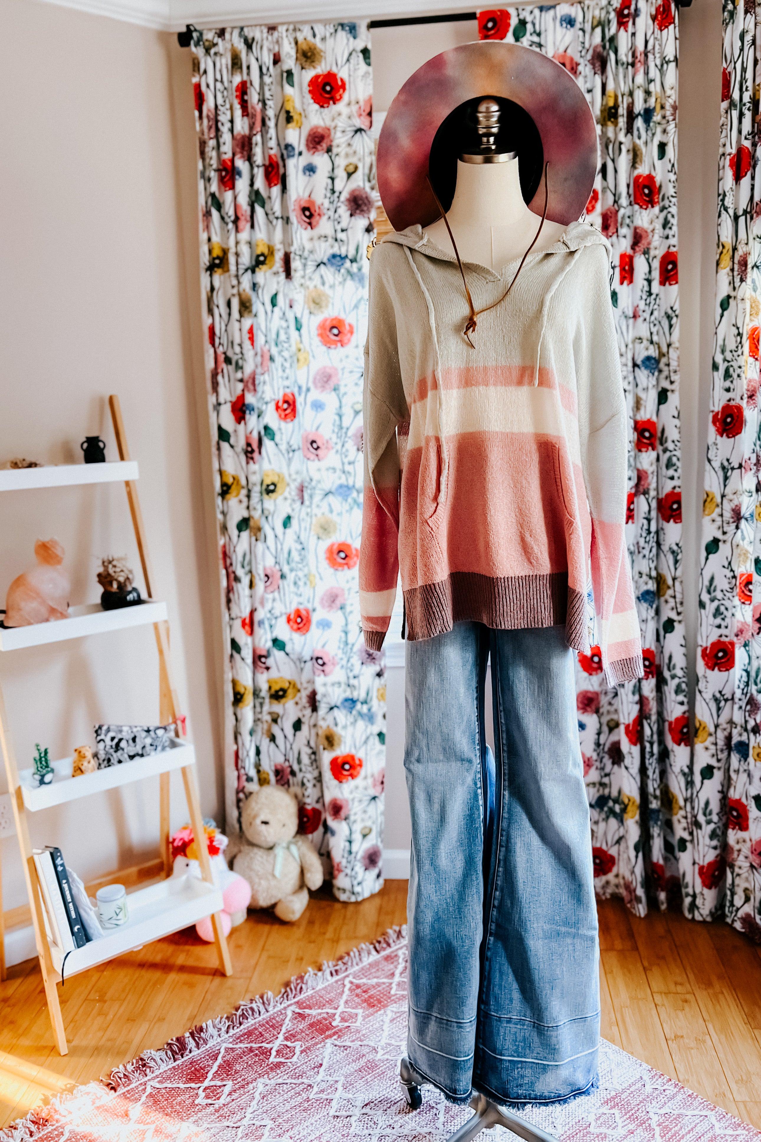Striped Boy Problem Spring Hoodie displayed on mannequin with wide-leg jeans and wide brim hat in floral room