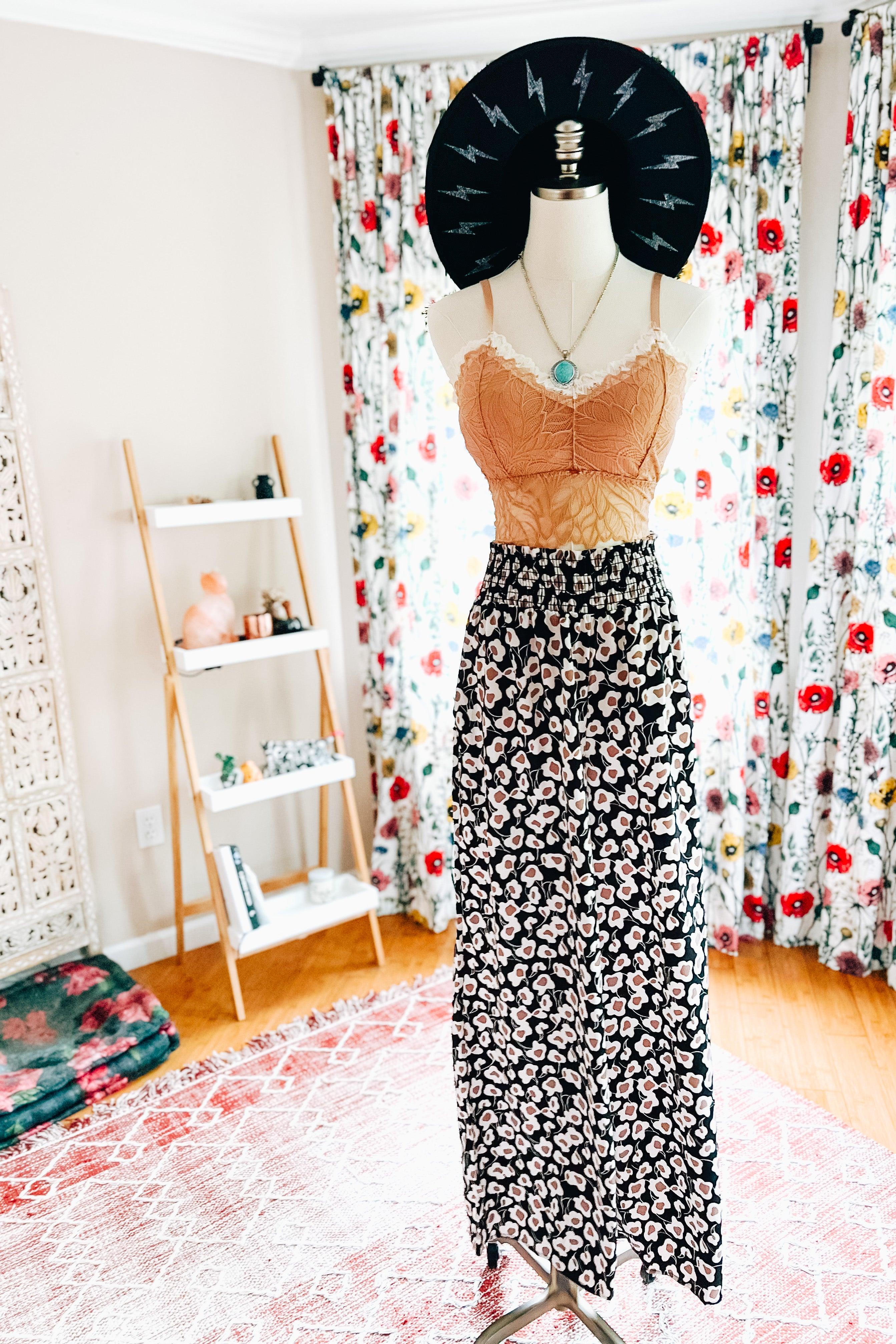 Flowers In Your Hair Retro Vintage Print Smocked Pants in black and ivory floral pattern displayed on mannequin indoors