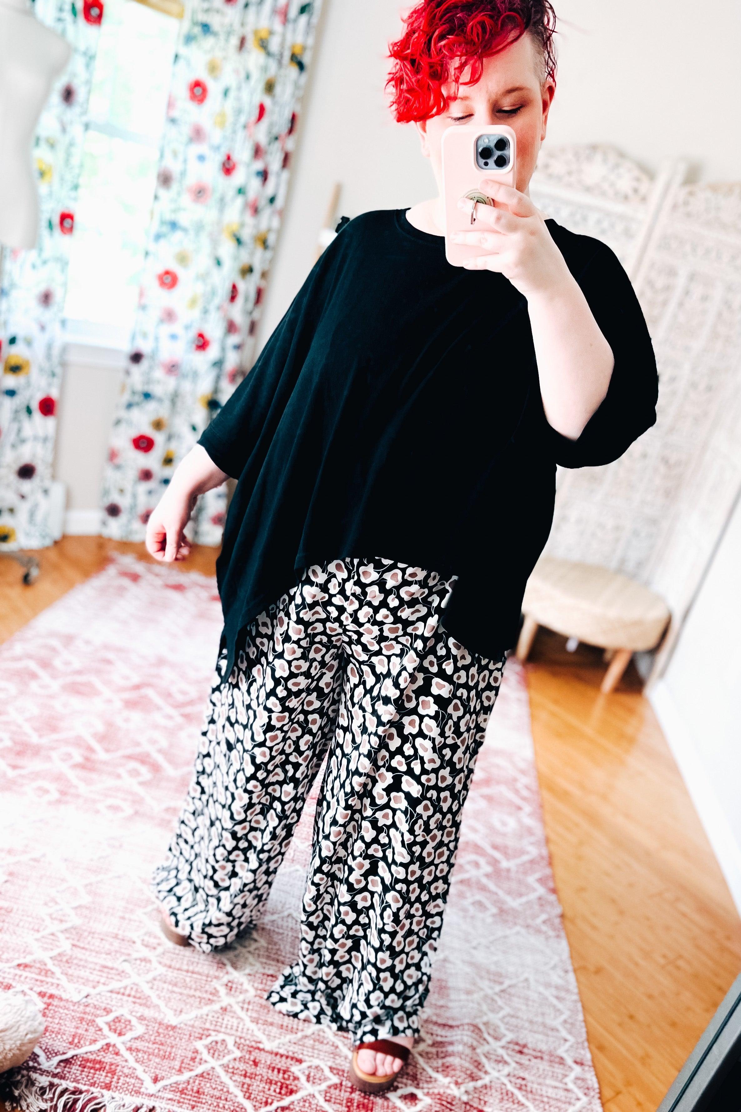 Flowers In Your Hair Retro Vintage Print Smocked Pants in black and ivory floral pattern paired with loose black top indoors
