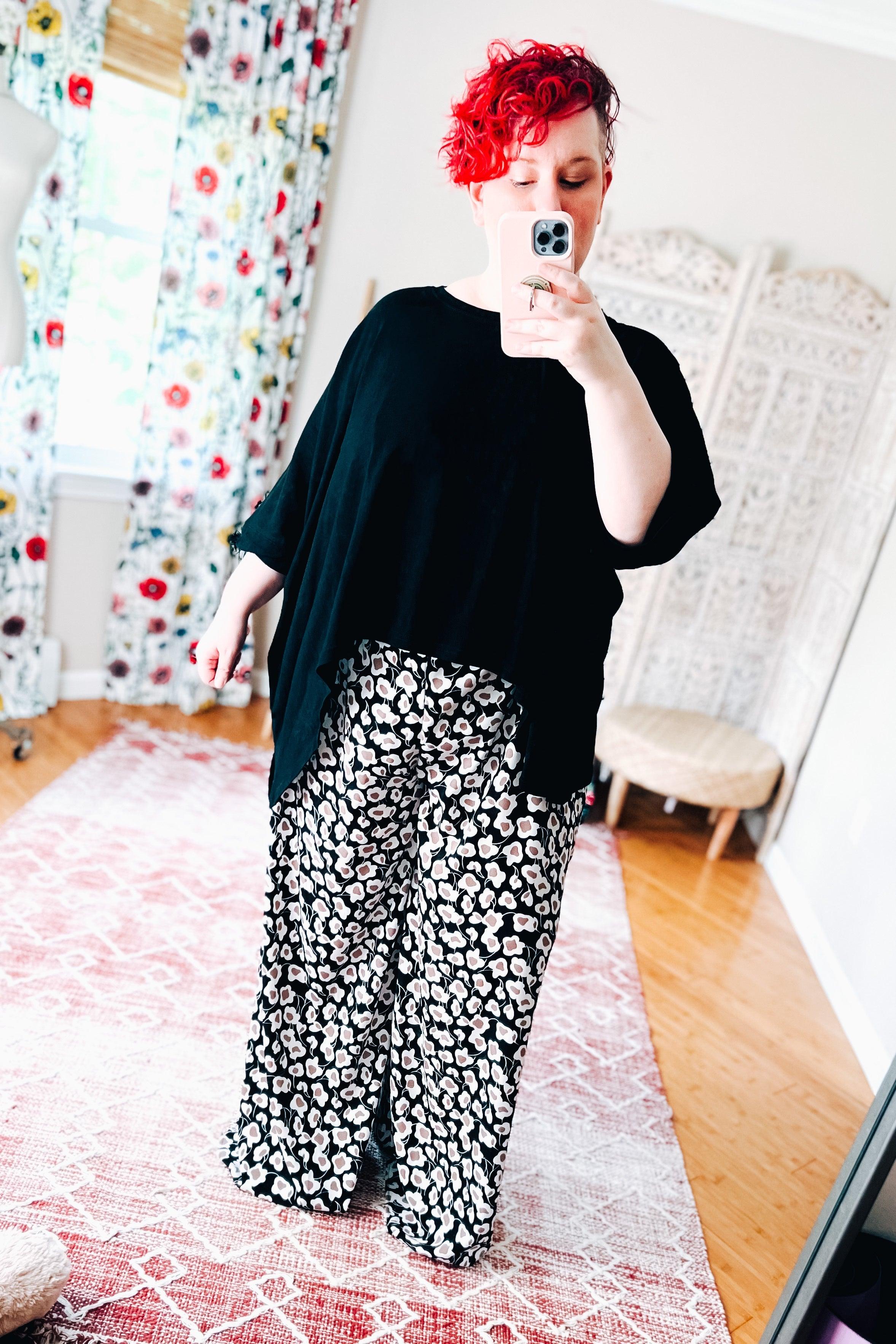 Flowers In Your Hair Retro Vintage Print Smocked Pants in black and ivory worn with loose black top indoors