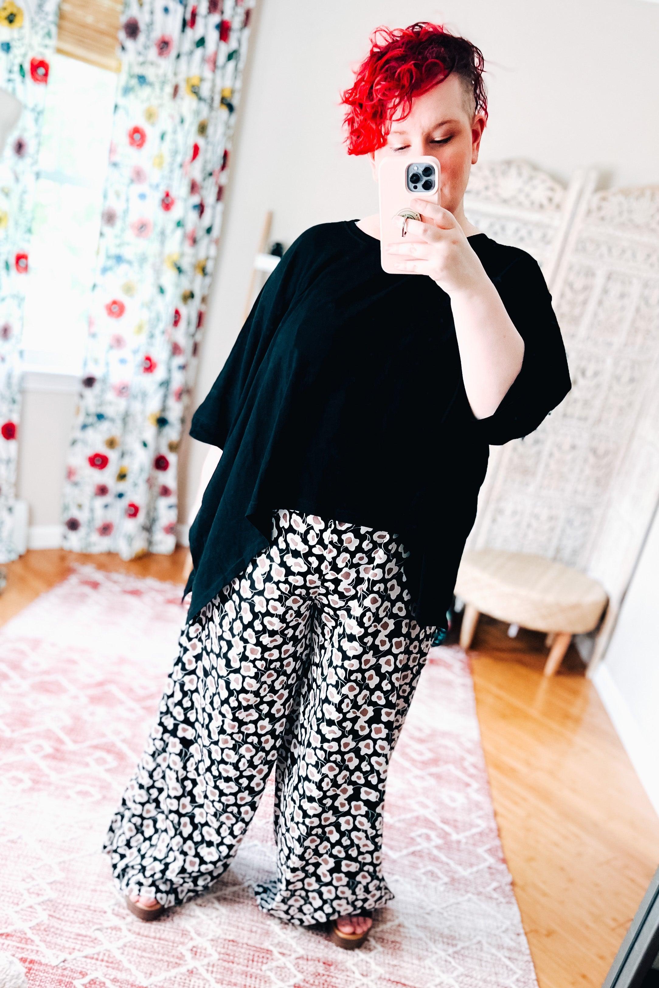 Flowers In Your Hair Retro Vintage Print Smocked Pants in black and ivory worn with loose black top indoors