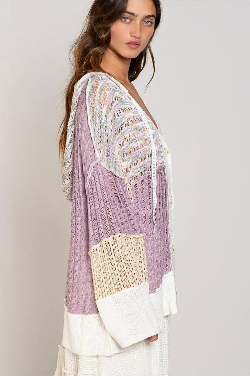 Side view of a lightweight lavender and cream open-knit cardigan with patchwork design and textured sleeves