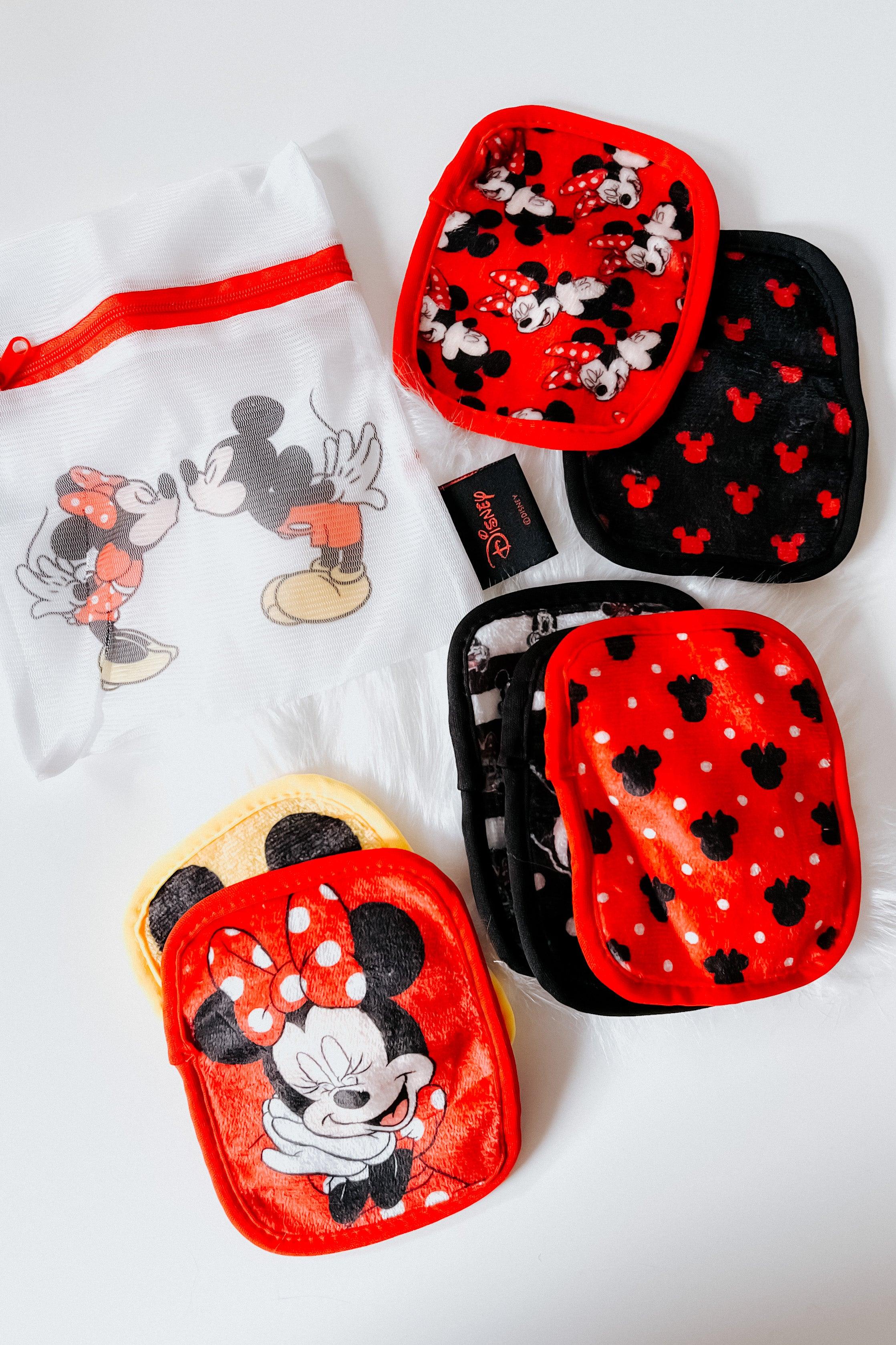 Red and black reusable makeup remover pads featuring Disney Mickey and Minnie Mouse designs with a white mesh storage bag