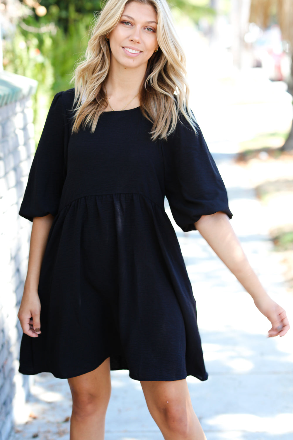 Can’t Tame Her Three Quarter Puff Sleeve Babydoll Dress • Black