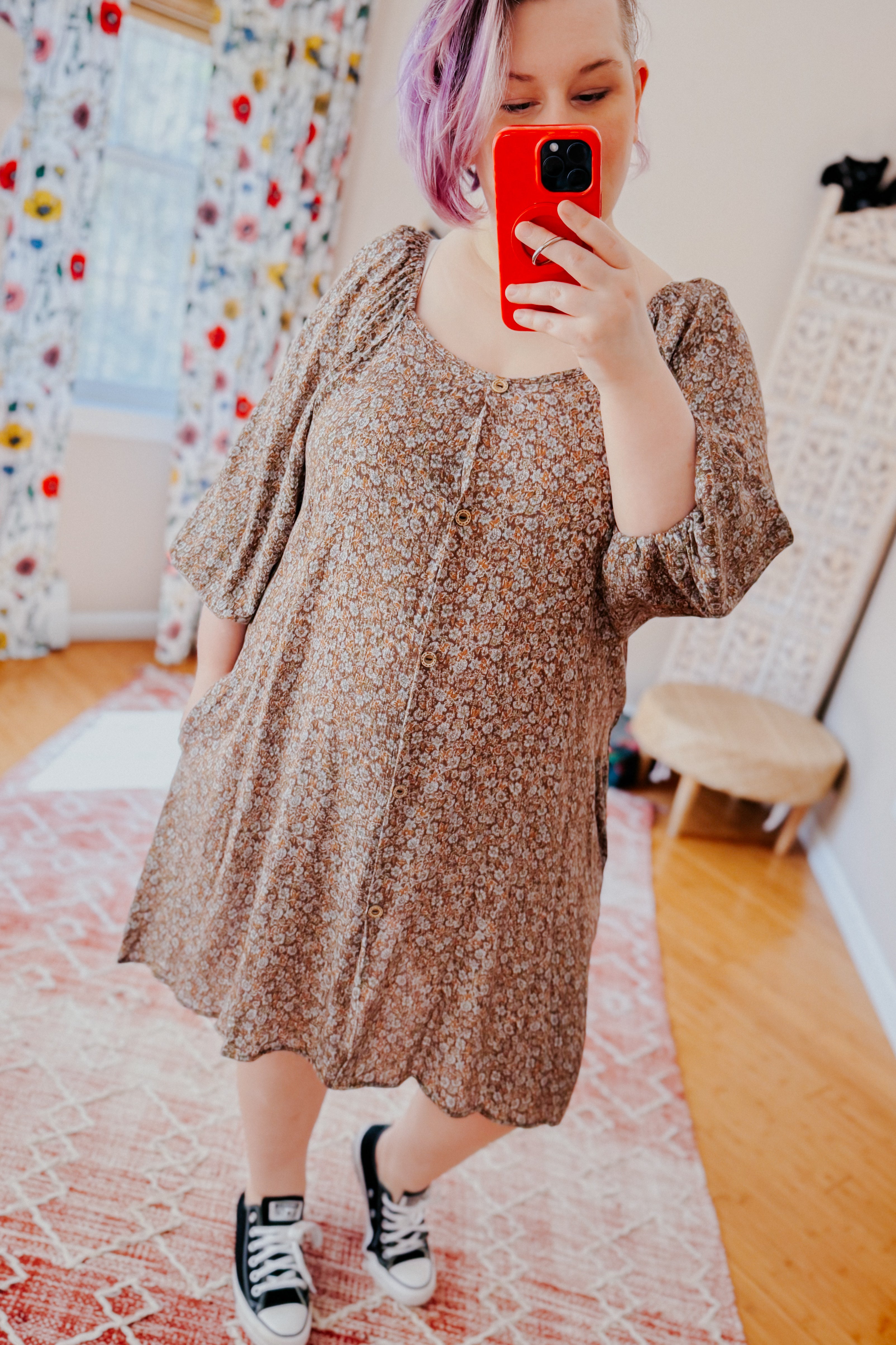Woman with lavender hair taking mirror selfie wearing Autumn Feels Floral Dress with buttons and puff sleeves