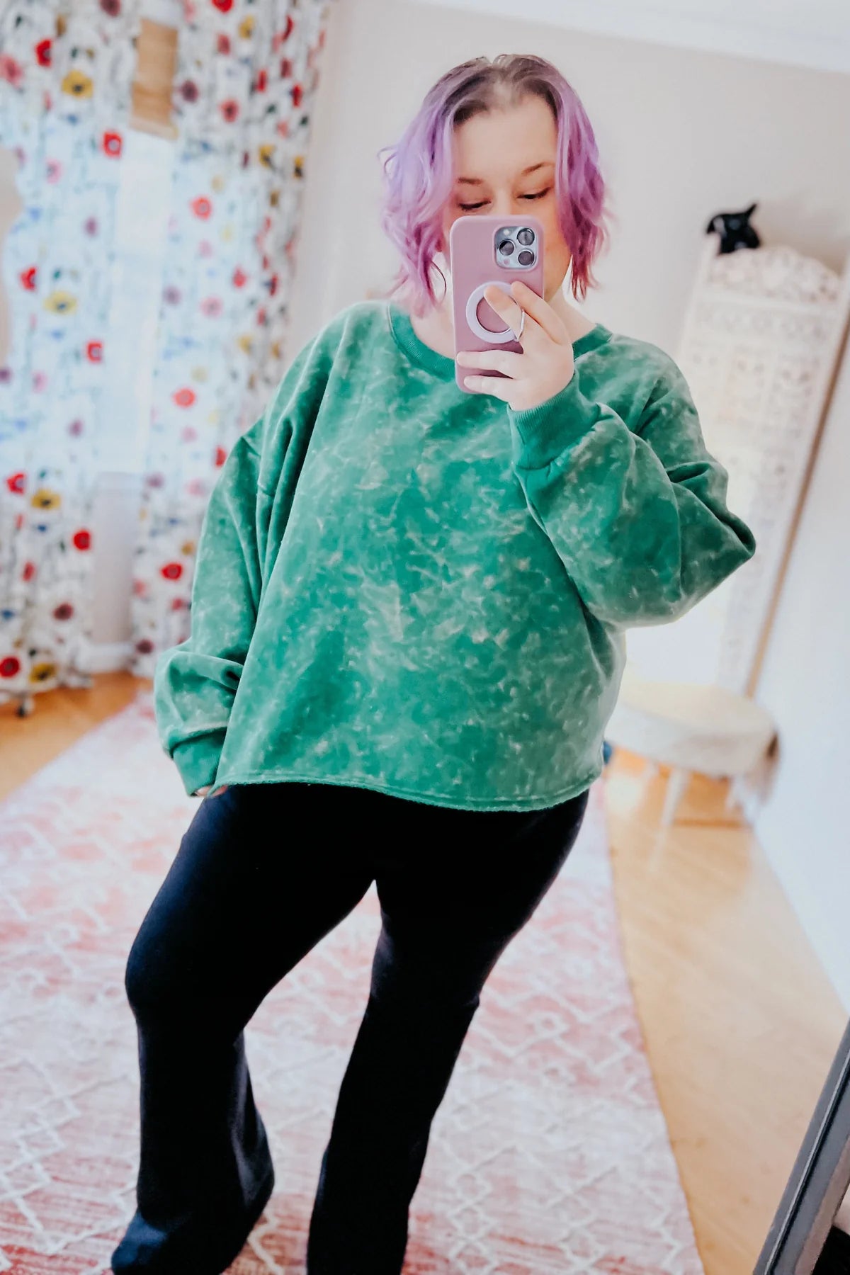 Person modeling sea green acid wash pullover with relaxed fit and black pants taking indoor mirror selfie, IMG_9833.webp