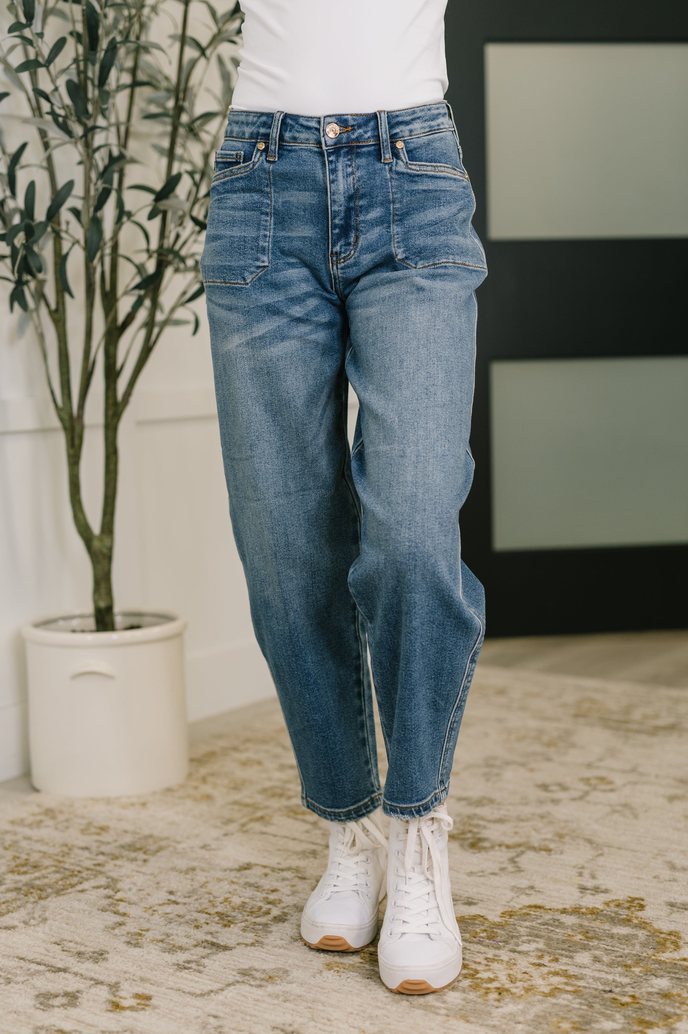 Front view of Bella High Waist jeans in Bella-6.jpg with relaxed fit and visible soft barrel stitching indoors