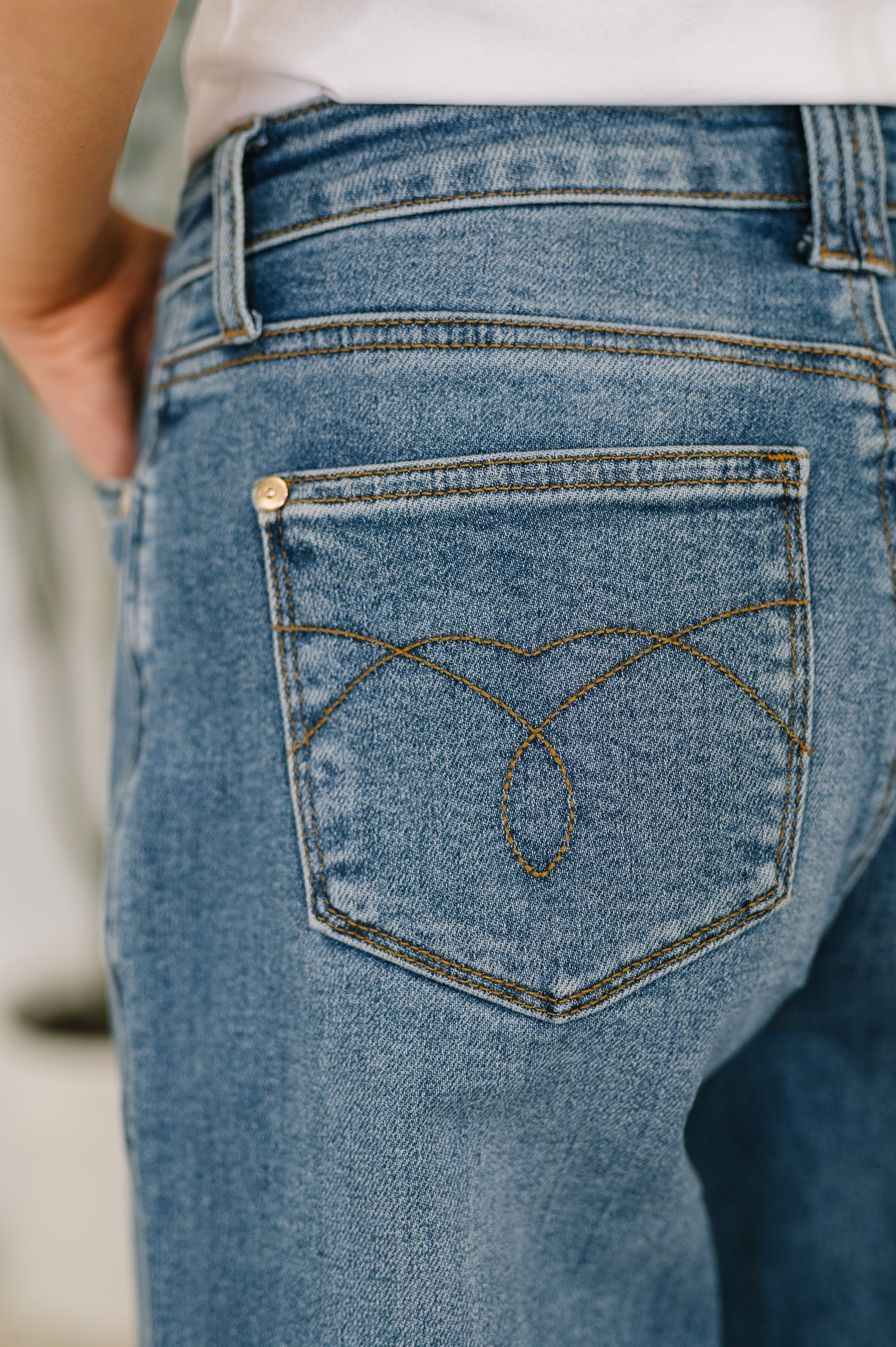 Close-up of Bella High Waist jeans pocket with unique soft barrel stitch detail