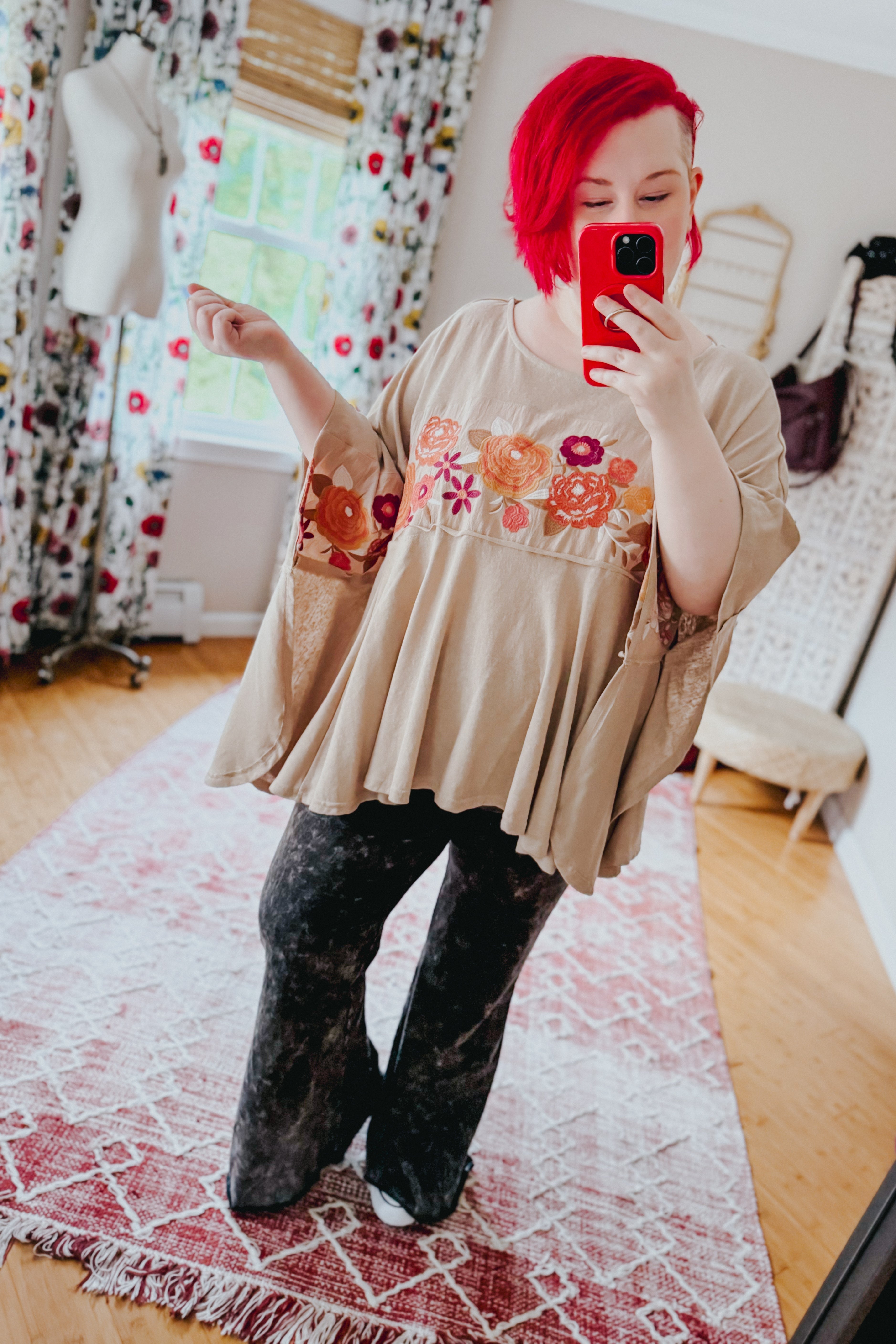 Woman taking mirror selfie wearing mocha Isabel Embroidered Tunic with floral embroidery and wide sleeve design