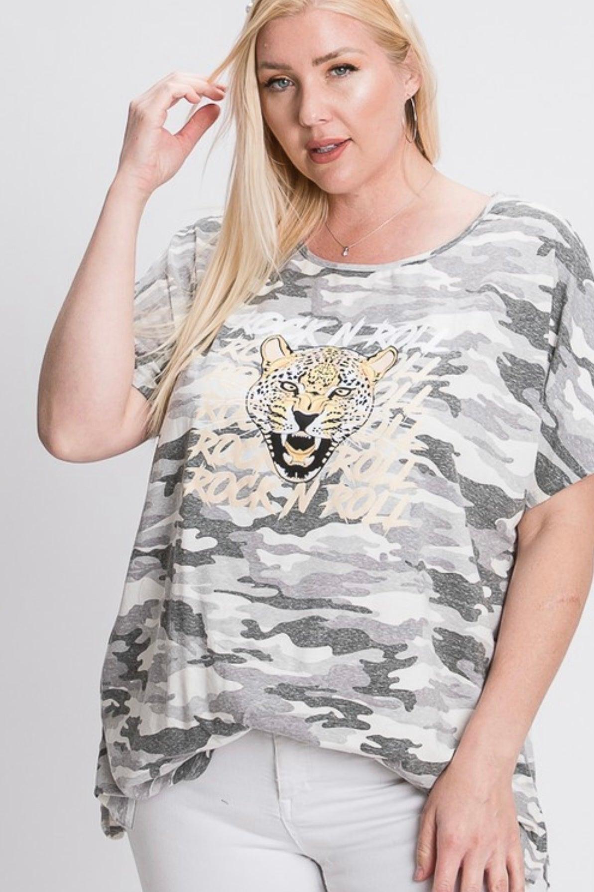 Plus size woman wearing grey camo Rock N Roll Leopard Tee with bold leopard graphic paired with white pants