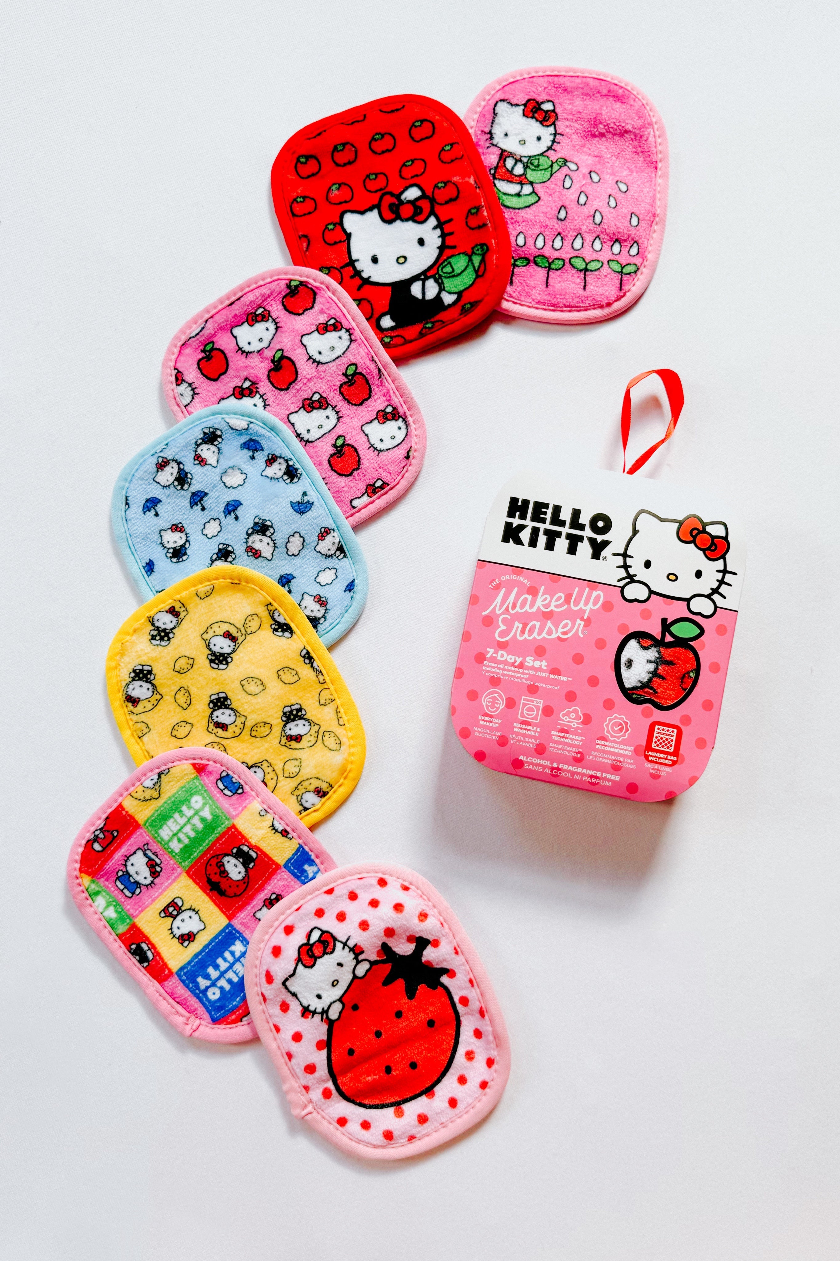 Collection of colorful Hello Kitty-themed reusable makeup erasers in red, pink, blue, and yellow with packaging on white background