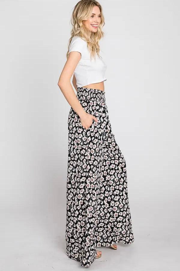 Flowers In Your Hair Retro Vintage Print Smocked Pants in black and ivory floral pattern styled with cropped white top and sandals