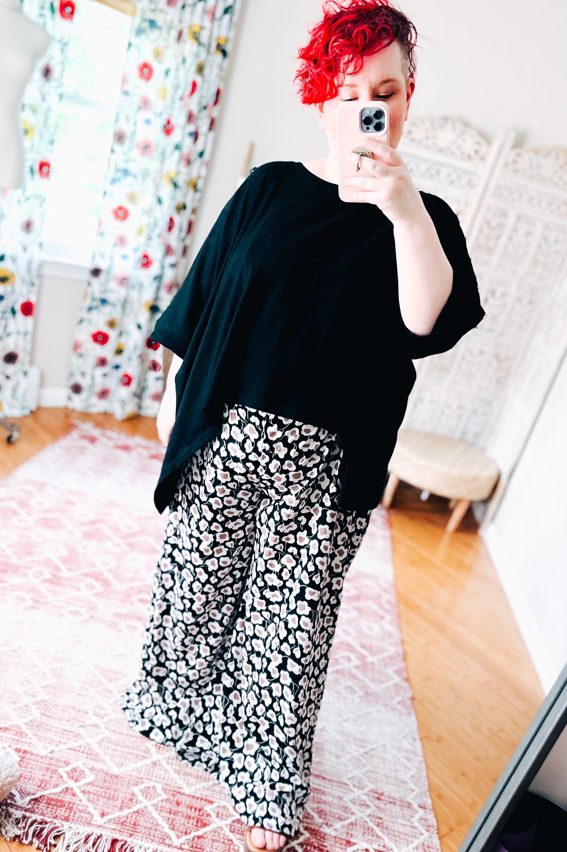 Flowers In Your Hair Retro Vintage Print Smocked Pants in black and ivory floral pattern worn with loose black top indoors