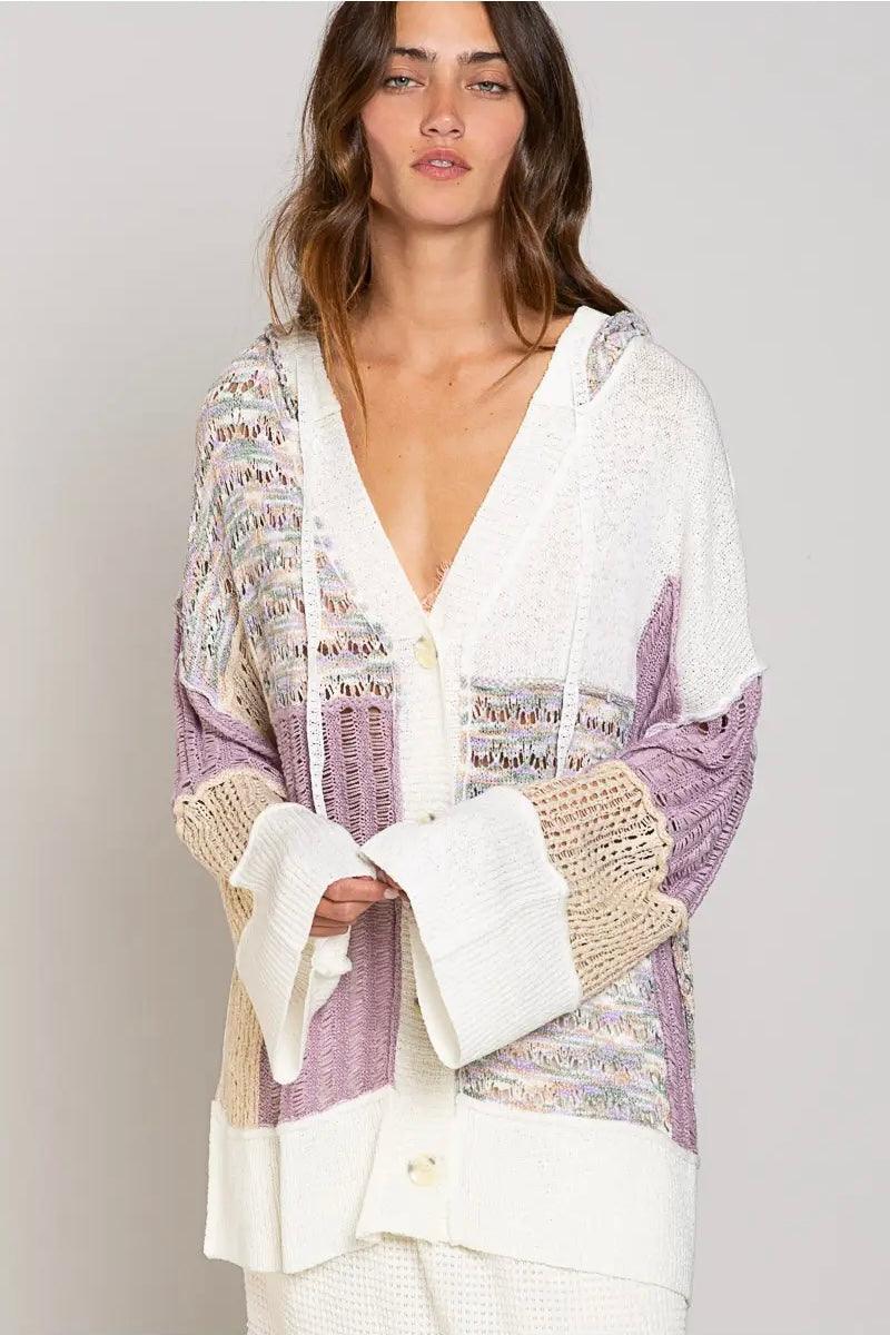 Chunky knit cardigan with lavender, cream, beige, and multicolor panels, featuring an oversized fit and button front closure