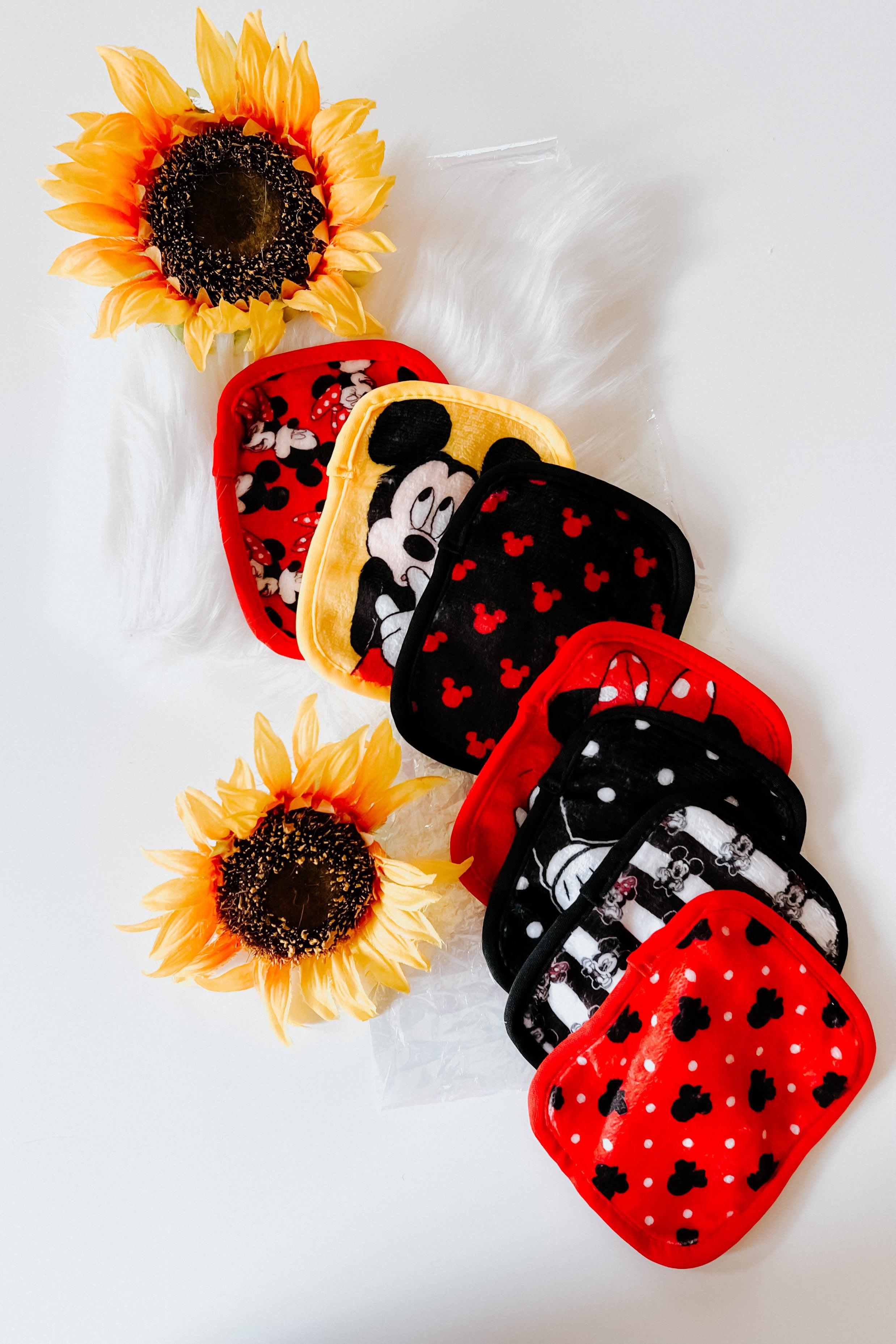 Set of colorful red and black makeup remover pads with Disney Mickey and Minnie Mouse and playful polka dot patterns