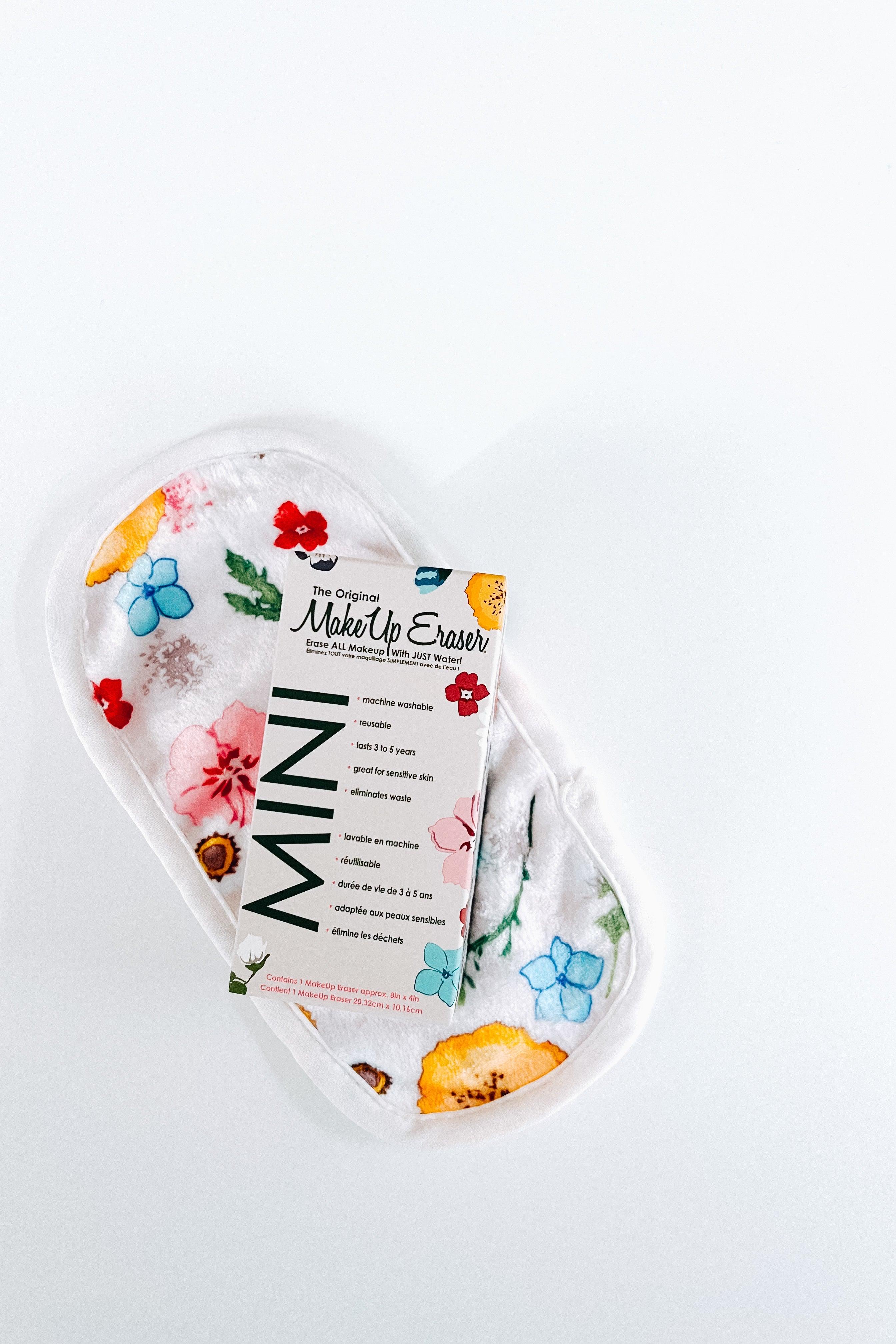 Mini-sized washable makeup remover cloth with vibrant wildflower patterns in multicolor on white background
