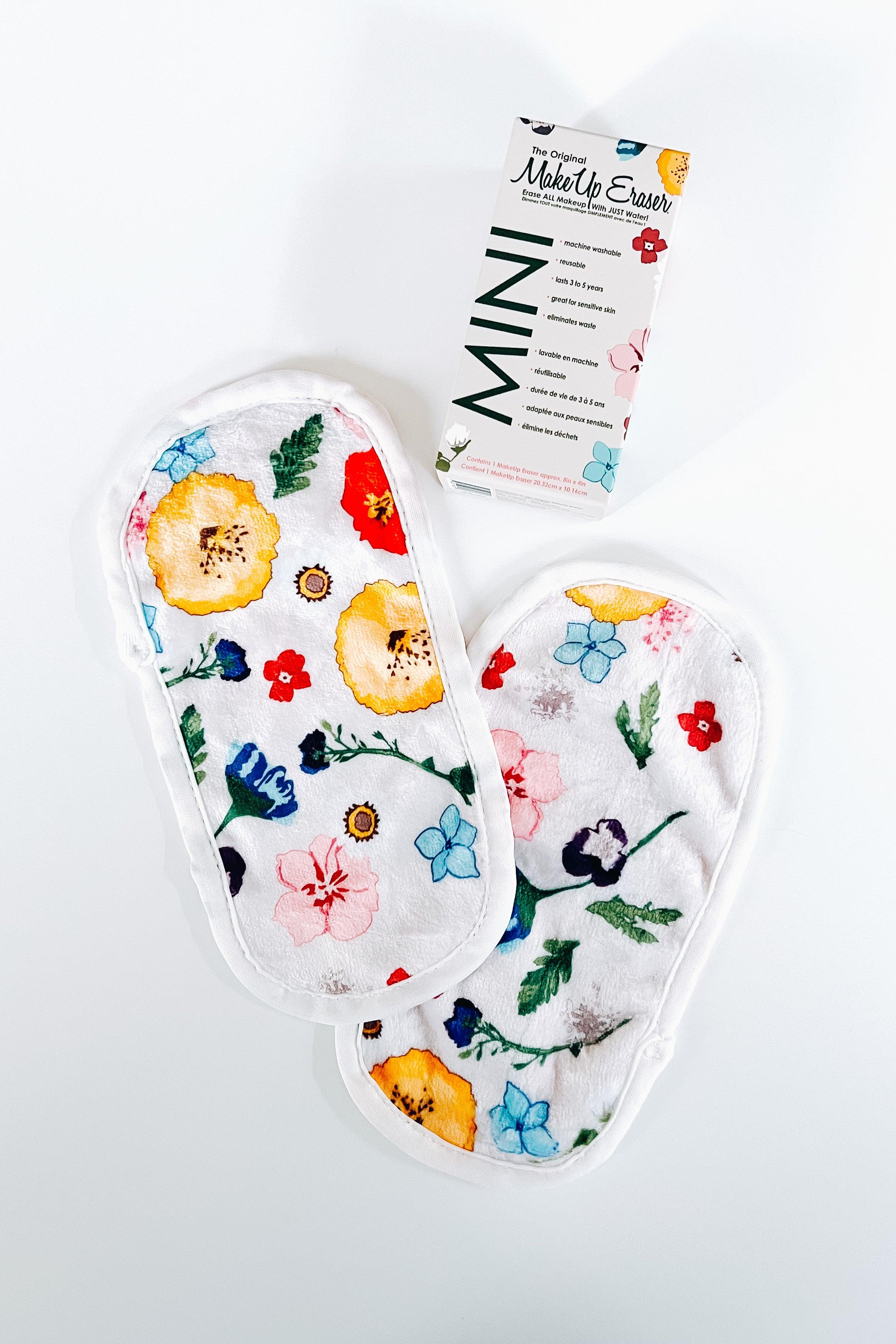 Mini makeup remover pads with colorful wildflower prints beside branded packaging on white background