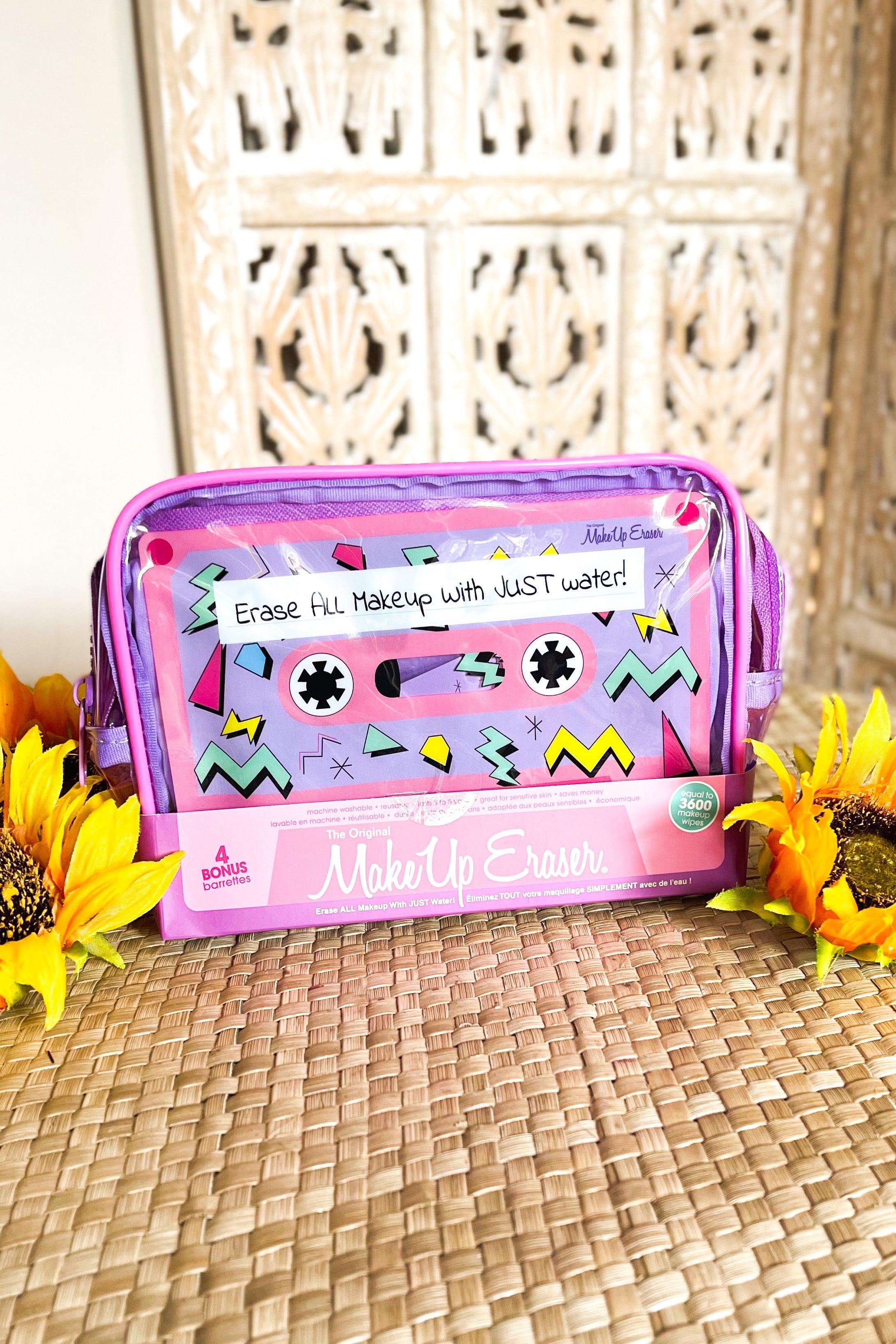 Purple makeup eraser pouch with retro cassette design reading erase makeup with just water surrounded by sunflowers