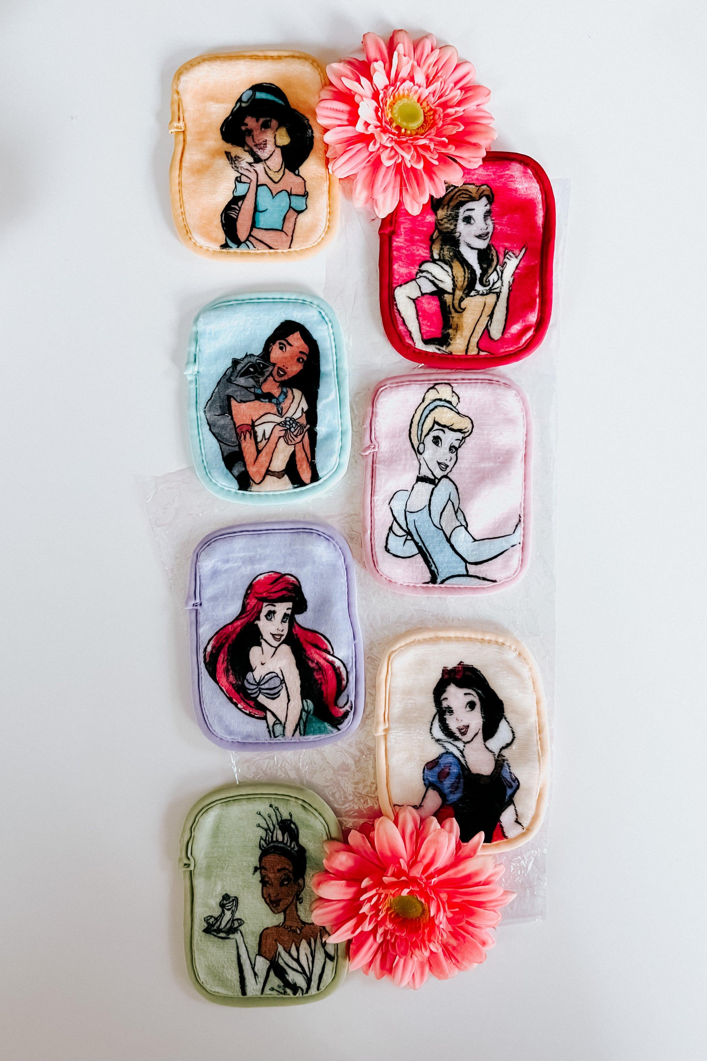 Seven multicolor plush makeup remover cloths featuring Disney princesses arranged vertically with pink flowers on white background